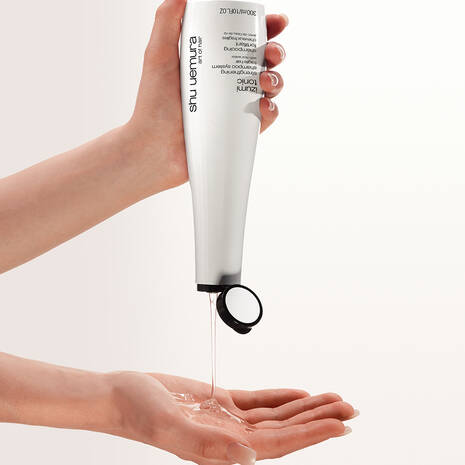 shu-uemura-art-of-hair-izumi-tonic-hair-strengthening-rice-water-shampoo-in-hand.jpg
